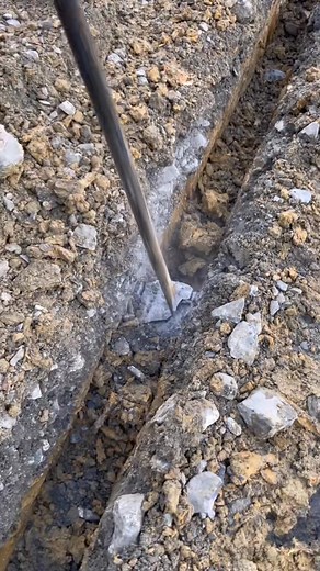 We trenched and installed PVC downspout drain pipes under the parking-000 | Garage-2