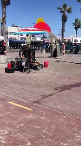 Street Performer Plays Music on the Boardwalk in Mission Beach, San Diego - NewsBreak