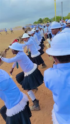 Traditional Dance Performance with Flags and Sticks