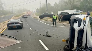 Deputy assists at overturned car crash scene at busy Macon intersection