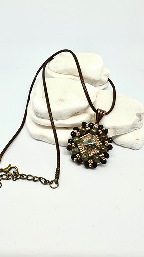 I love this pendant made from items in this month’s Potomac Beads Treasure Box: RounDuo Beads, Azuki Seed Beads, Potomac Crystal Rounds, and the Waxed Cotton Cord. In conjunction with a couple of items from beading stash (Potomac Crystal Rivoli and an Antique Copper Bail), this necklace can be worn to dress up a simple T-shirt and jeans or enhance a little black dress. #PotomacBeads #BestBeadBox #DesigningBetterBeaders #handmadejewelry #handmade #jewelry #handmadewithlove #jewelrydesigner #jewel