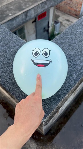 Experiment: Will a water balloon explode if it rolls down a tall building? 💥🎈#shorts
