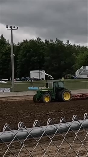 Witness the thrill of a tractor pull and carnival rides! We'll see a green tractor in action and a woman enjoying a fair. Then, experience the dizzying spin of The Twister ride. Join us for this exciting day! #TractorPull #Carnival #FairFun #GreenTractor #TwisterRide #Fairground #Festival #FarmLife #AmusementPark #FamilyFun | Siegler Dairy Farm