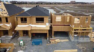 Download Drone Footage of New Houses under Construction, Aerial Drone footage of New home construction in a urban boundary, various model homes under construction during a new phase of expansion, 4k Video for free