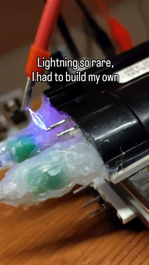 Alexis Christoforatos on Instagram: "30kV in my bedroom💀 ⚠️ WARNING : You should not try this at home, high voltage could be lethal Atmospheric air acts as an insulator until the electric field intensity reaches a critical threshold known as the dielectric strength, which for dry air is approximately 30 kV/cm (or 3 kV/mm) at standard temperature and pressure. When the potential difference between your electrodes exceeds this value, the electric field is strong enough to strip electrons from gas