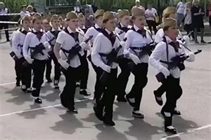 Russian primary school kids as young as 7 march with guns and sing 'no mercy'