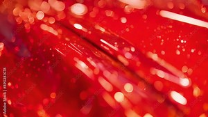 A closeup of a candy apple red car paint finish with layers of bright red and gold flecks creating a deep and rich color.