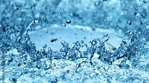 Super slow motion of splashing water in circles. Filmed on high speed cinema camera, 1000 fps.