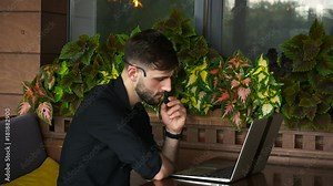 Internet consultant talking to client with web camera and microphone.