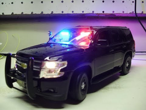 Custom 1:24 scale unmarked Chevy Tahoe police diecast model with working lights and siren