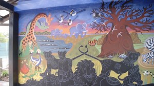 10K views · 94 reactions | Local artist Theresa Norris had so much fun painting the amazing Tingatinga-style mural inside the new lion habitat at the Zoo. Watch as Theresa discusses her inspiration for the mural and what she hopes visitors will take away from it when they see it for the first time. Guests will get to have some fun with the mural as the lions are drawn on with chalk paint! #TheRoarReturns | Audubon Zoo | Facebook