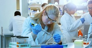 Female scientist experimenting in laboratory 4k