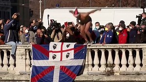 Italians see in the New Year by diving into Rome's freezing Tiber River