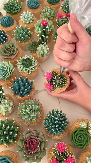 Dailyart Unity on Instagram: "@kerrys_bouqcakes 🌸🧁 transforms cupcakes into breathtaking floral displays, where every petal and bloom is sculpted from buttercream with remarkable precision. Operating out of Norfolk since 2013, she has built a thriving business that brings together artistry and baking, showcasing hyper-realistic flowers such as orchids and dahlias in every creation. 🌼"