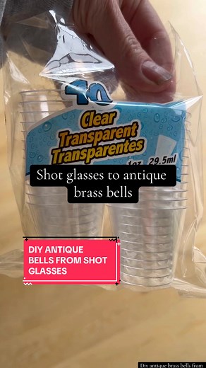 Want those antiques brass bells but don’t want to break the bank? Make them from dollar store plastic shot glasses, paint and rub n buff. #christmasbells #brassbells #diybells #diychristmasdecor #dollartreechristmasdecor