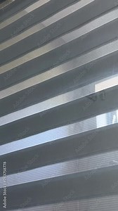 Open and close blinds Glass wall between the room and the toilet in bathroom