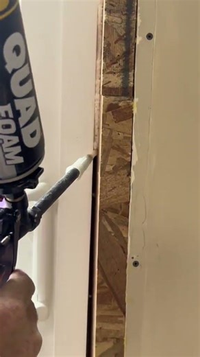 Expanding foam is applied around the door to fill in gaps creating a tight, efficient seal. #install