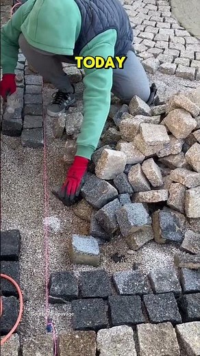 The process of installing paving blocks in the ancient Roman style