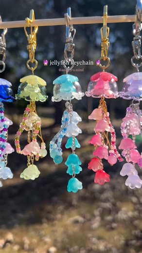 it's val ʚ♡ɞ on Instagram: "Jellyfish keychains available on my Etsy shop! Link in bio 🪼🩵 Hey! On my Etsy shop you can find jellyfish keychains in several colors like purple, light and dark blue, light and dark green, and pink 💘🙂‍↔️ which one would you get? 🔖 #jewelry #charms #jellyfish"
