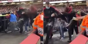 Video shows rugby pitch invader being soaked with beer by furious fans