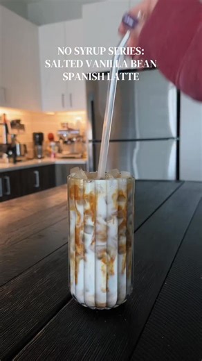 No Syrup Series: Salted Vanilla Bean Spanish Latte☕️✨ ✨ vanilla bean paste ✨ pinch of salt ✨ sweetened condensed milk ✨ 2 shots espresso ✨ milk of choice ✨ ice ✨ sweetened condensed milk on top #nosyrupsneeded #coffeetime #icedlatte #coffeeathome #spanishlatte | Foodieeshh