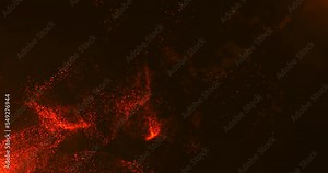 A vortex of orange particles slowly unfolding against a dark red background. Bokeh particles. Sparks from the fire in the light of the flames.