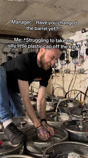 Humorous Bartender Struggles with Keg Cap