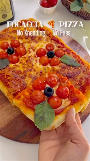 Nidhi Khosla on Instagram: "EASY NO-KNEAD FOCACCIA PIZZA 🍕✨ Crispy, airy & super simple! Made using Vimal Wellness Extra Virgin Avocado Oil for that perfect texture. Save this for your next pizza night! 1️⃣ Whisk 2 & 1/4 tsp active dry yeast with 1/2 cup warm water & 1 tsp sugar. 2️⃣ Add 3 cups flour, 1 cup warm water, 1/4 cup avocado oil & 2 tsp salt. Mix into a sticky dough. 3️⃣ Cover & let rise for 1 hour until doubled. 4️⃣ Grease a sheet pan with oil & spread the dough. Preheat oven to 200°