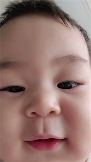 Looking at the baby's cell phone