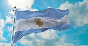 Flag of Argentina realistic waving in the wind with cloud background (Perfect Loop)