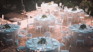 Street cafe with empty tables and chairs