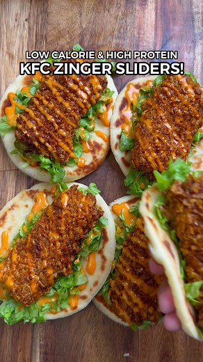 Healthy Low Calorie & High Protein KFC Zinger Sliders! 🔥 Ingredients 👇🏼 - 475g Chicken Breast (raw - cut into five strips weighing approximately 95g each) - Salt, Garlic Powder, Paprika, Cayenne Pepper (optional) - 50g Cornflakes (crushed) - 2 Eggs (mixed - not all of it is used) - 120g Plain Flour (Vetta Smart Plain Protein Flour - or you can use mini tortillas) - 100g Low Fat Greek Yoghurt - 1.5 Tsp Baking Powder - Zinger Sauce: 75g Low Fat Greek Yoghurt, 1 Tsp Paprika & Sriracha - Lettuce 