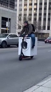 Innovative Scooter Design A man rides a washing machine scooter, showcasing creativity in the city! #fblifestyle #AI Generated using Kling AI . . . (For entertainment purposes only. Consult professionals if guidance on activities is presented. No brand affiliation is implied if any are shown. If inspired by true events, creative adaptations may be included. Content may include public footage.) | Fabiosa Hearty