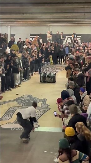 Epic Skateboarding Tricks at a Packed Indoor Event