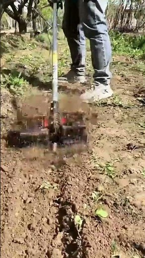 Tilling Garden Soil Using A Handheld Tiller For Efficient And Professional Farming Work