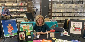 Karin McCay reading books Friday at Science Spectrum