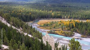 Panning from the Banff Hoodoos to the towering mountains.