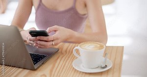 Phone, laptop and hands of woman with coffee in cafe network on social media, mobile app or internet. Technology, cappuccino and female freelancer typing email on cellphone and computer in restaurant