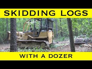 Caterpillar D5 Skidding Logs With A Dozer