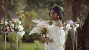 clip-1074866120-portrait-african-american-bride-beautiful-wedding-dress