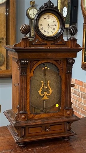 In the late 1800s, two German powerhouses — Symphonion and Junghans — joined forces in a unique collaboration. Symphonion brought the music, Junghans brought the clockwork, and together they created coin-operated music boxes topped with working clocks. Drop a penny, wind the crank, and the whole room came alive with a melody and the ticking rhythm of time. Lot 27 in the November 15th Clock and Watch Auction, a late 19th century Symphonion coin-op music with the original Junghans clock incorporat