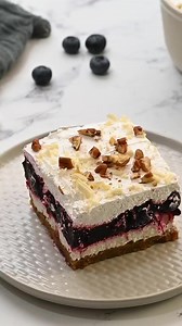 This blueberry delight recipe is four delicious layers of buttery graham cracker-pecan crust, velvety cream cheese, whipped cream, and sweet blueberry pie filling. It’s a refreshing dessert that’s perfect to make the next time you are feeding a crowd. https://spaceshipsandlaserbeams.com/blueberry-delight/ . . . #BlueberryDelight #DessertLovers #SweetTreats #BlueberryRecipes #HomemadeDesserts #DeliciousDesserts #EasyDesserts #FruitDesserts #YummyTreats #DessertTime #spaceshipskitchen | Spaceships