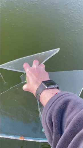 Breaking Ice on a Koi Pool || ViralHog