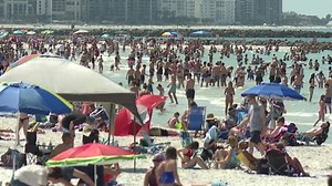 Visitors pack beach despite coronavirus warnings
