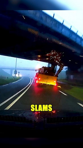 Excavator Strike Causes Tractor Crash Dash cam video captures a tractor towing an excavator that’s too tall for a railway viaduct. The excavator smashes into the bridge, causing the driver to lose control and overturn in the verge. #DashCamFootage #RoadAccident #TransportSafety #BridgeCollision #DriverAwareness | Dash Crash
