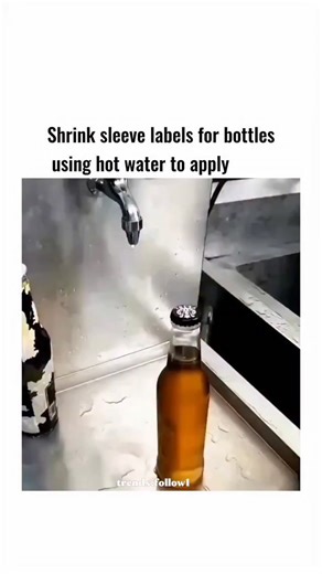 💀 on Instagram: "The video illustrates a straightforward DIY technique for applying shrink sleeve labels to bottles by sliding a pre-printed plastic sleeve over the container and using a handheld steam gun to heat and contract it, demonstrating thermal shrinkage in polymers like PET. This method leverages the material's negative coefficient of thermal expansion, where heating causes the sleeve to tighten uniformly around irregular shapes, a principle commonly used in industrial packaging but ad