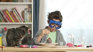 boys cientist doing experiments. Education concept. Preschooler interests. Smart little child doing chemical research at home laboratory. Dangerous experiment. Home activities for children.