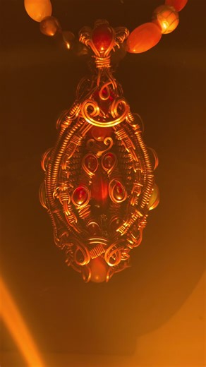 Behold! What I consider my first masterpiece. Fire & Ice. Double-sided.This is the culmination of over 6 years of hard work and experience. Skill cresting in a confluence of connecting patterns moving through dimensions of insight and understanding. Included is a grand total of 28 stones. Here is the recipe imbued top to bottom: Fire: Fluorescent Ruby, Tumbled Red Beach Glass, Carnelian, X6 Red Auric Glass, Red Treated Tigers Eye, Red Treated Vintage Moonstone. Ice: Rainbow Moonstone, Faceted Am