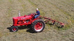 Two tractors and two tedders...how much equipment is needed to ted three acres of hay? It's a good opportunity to put the Farmall MD and the Farmall Super C tractors to work. | Just a Few Acres Farm