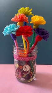 These yarn flowers are a fun and easy Mother’s Day craft idea. Little kids will enjoy the kids yarn craft activity for Mother’s Day. Start by wrapping the yarn around a fork, attach a pipe cleaner, cut the loops, and fluff up the yarn. Your mom will love these handmade flowers that will never wilt. #mothersday #kidscrafts #easycraft #kidsactivity #momgift #handmadegift #yarncraft #mom #flowers | Timm Sevitz